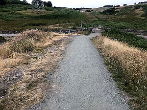 Dumyat hill run. Through the gate and back onto tarmac