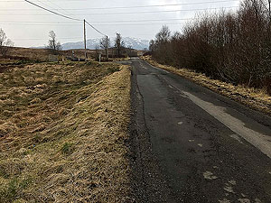 Loch Katrine marathon. This section of road is the halfway point.  Round the cone and back to the start.  Our picture taken some months after the actual race so the cone has gone back to its cupboard.