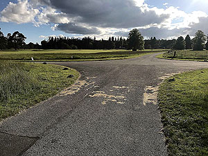 Loch Skene . Crossing where you turn left on the road across the course