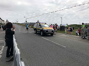 Barrathon. Finisher coming in past the coast guard