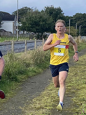 Trident 10K :  HAAC runner at finish line