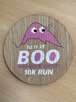Bridge of Orchy 10k  : A coaster instead of a medal.  Notice the ghost is the route map